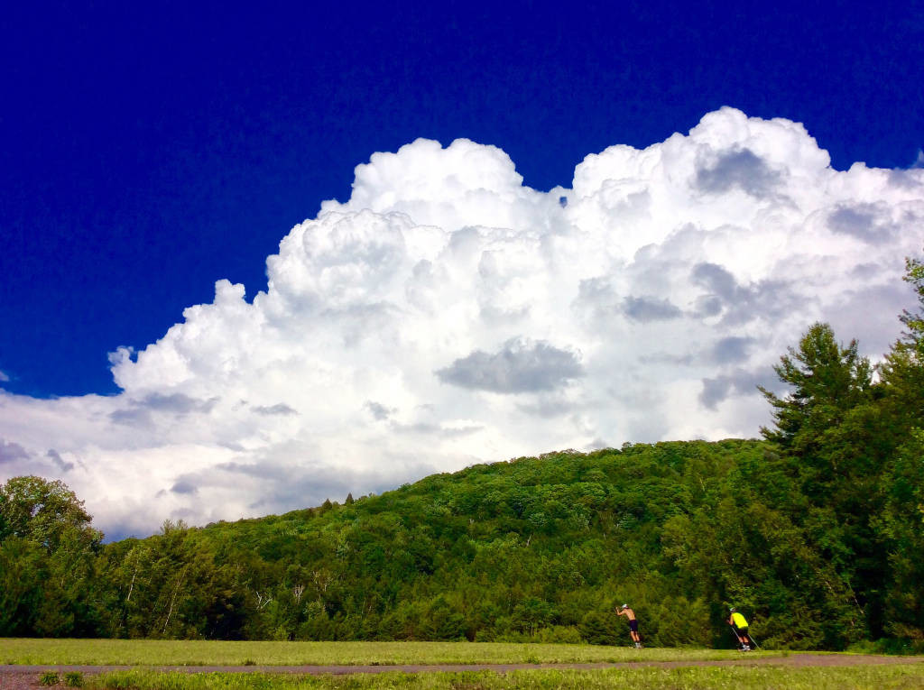 Skiing the penalty loop while a lingering thunderhead looms overhead