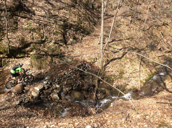 The rewards of the climb: a long downhill with sweeping mountainside ravines